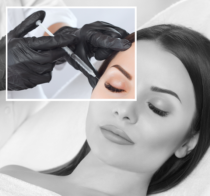 A cosmetic procedure being performed on a patient's face, focusing on their eye area.
