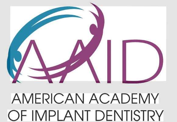 Logo of the American Academy of Implant Dentistry featuring stylized graphics and the organization's name.